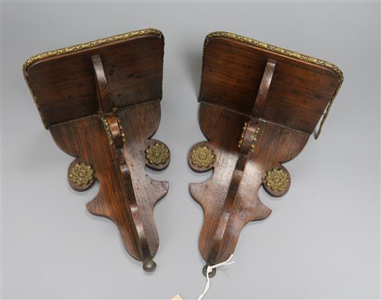 A pair of 19th century brass-mounted faux rosewood wall brackets